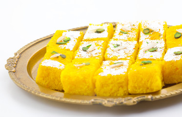 Indian Popular Sweet Food Khopara Pak or Coconut Burfi made up of Coconut, Milk And Sugar Isolated on White Background