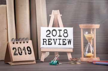 2018 review concept. Sandglass, hourglass or egg timer on wooden table showing the last second or last minute or time out