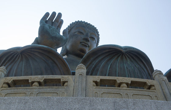 Closeup horizontal photo of Tian Tan Buddha, Lantau Island, Hong Kong. copy space in sky above buddha.