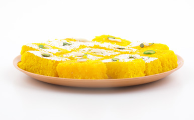 Indian Popular Sweet Food Khopara Pak or Coconut Burfi made up of Coconut, Milk And Sugar Isolated on White Background