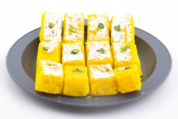 Indian Popular Sweet Food Khopara Pak or Coconut Burfi made up of Coconut, Milk And Sugar Isolated on White Background