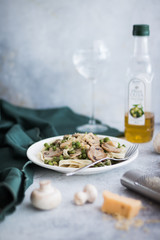 Pasta with Green Peas and Mushrooms on a White Background