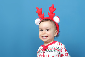 Charming little boy in Christmas pajamas