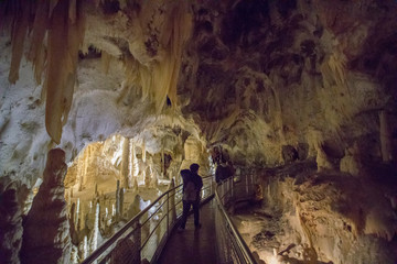 Giant Stalactite and Stalagmite Formations into the Cave at Frasassi Caves, Marche, Italy