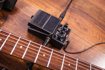 Black electric guitar with equipment