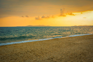 beach sand sunset / colorful of sunset on the beach sea with cloud yellow sky