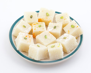 Indian Popular Sweet Food Khopara Pak or Coconut Burfi made up of Coconut, Milk And Sugar Isolated on White Background