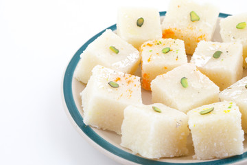 Indian Popular Sweet Food Khopara Pak or Coconut Burfi made up of Coconut, Milk And Sugar Isolated on White Background
