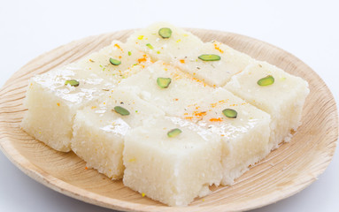 Indian Popular Sweet Food Khopara Pak or Coconut Burfi made up of Coconut, Milk And Sugar Isolated on White Background