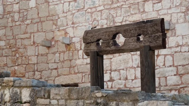 Footage of old wooden scary empty Punishment board, pillory
