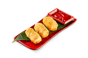 Closeup plate of tasty crispy cheese nuggets served with ketchup isolated at white background.