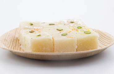 Indian Popular Sweet Food Khopara Pak or Coconut Burfi made up of Coconut, Milk And Sugar Isolated on White Background