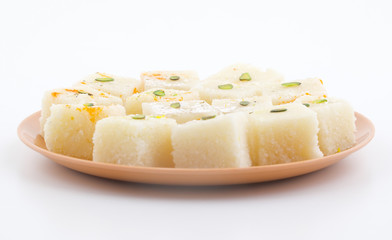 Indian Popular Sweet Food Khopara Pak or Coconut Burfi made up of Coconut, Milk And Sugar Isolated on White Background