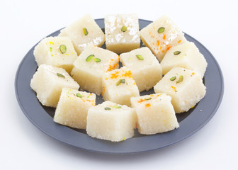 Indian Popular Sweet Food Khopara Pak or Coconut Burfi made up of Coconut, Milk And Sugar Isolated on White Background