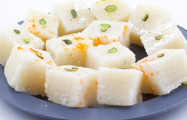 Indian Popular Sweet Food Khopara Pak or Coconut Burfi made up of Coconut, Milk And Sugar Isolated on White Background