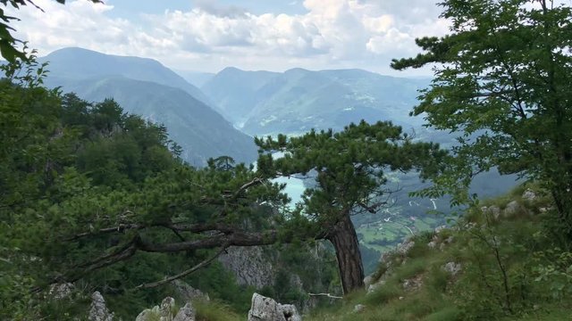 View from Banjska Stena viewpoint on Drina river and mountains in haze in cloudy summer day