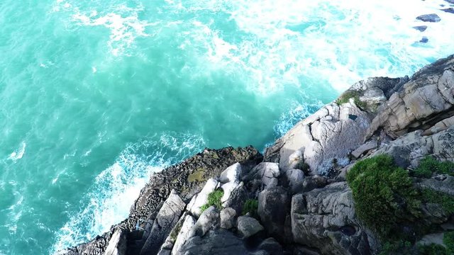 Atlantic ocean waves crushing into cliff rocks in Nau dos Corvos in Peniche.