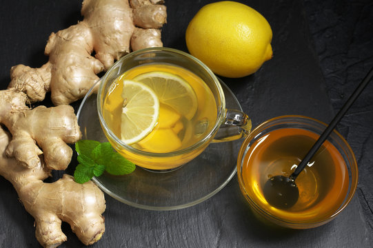 Ginger tea with lemon in glass cup