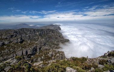 Fototapeta na wymiar On top of Table Mountain with clouds