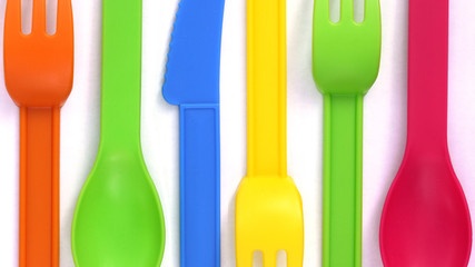 Fototapeta premium colorful plastic spoons on white background