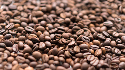 Coffee grains close up. Selective focus