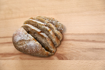 Sliced bread on a wooden table.