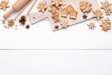 Christmas gingerbread sweets, spices on cutting board