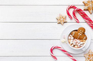 New Year gingerbread in cup of coffee on white background