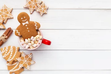 Foto op Plexiglas Gingerbread cookies on table in cup of hot chocolate © Prostock-studio