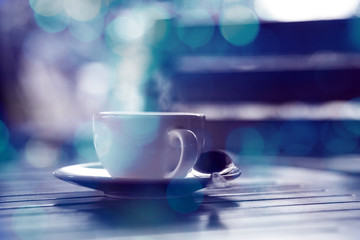 hot coffee and blue bokeh background