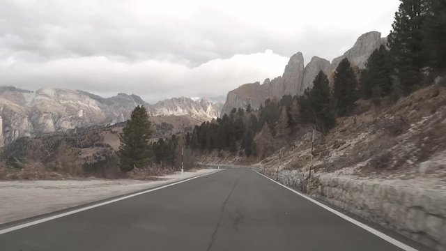 POV driving through Passo Pordoi in the Dolomites, Italy.