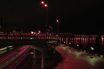 long exposure of road and bridge with illumination at night