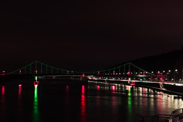 illuminated bridge with colorful lights at night