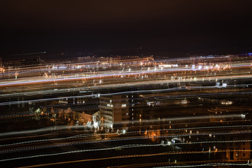 Fototapeta na wymiar night cityscape with blurred bright illumination
