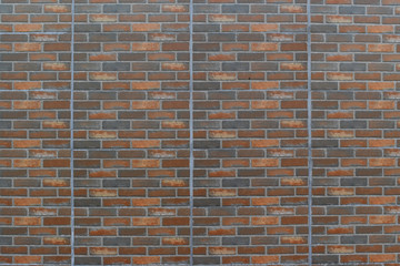 Red and brown brick wall background pattern.