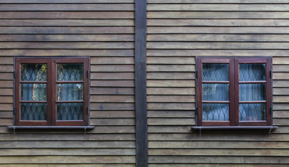 Fototapeta na wymiar Two wooden window on wood wall background. Texture vintage for interior.