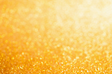 Abstract Gold glitter festive Christmas texture background blur with bokeh light