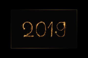 close up view of 2019 year light sign on black background