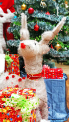 Close up white reindeer Christmas tree decorations and New Year background, Winter holiday decoration, selective focus