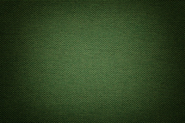 Dark green background from a textile material. Fabric with natural texture. Backdrop.