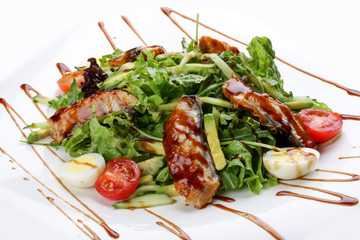 Salad with smoked eel on white background