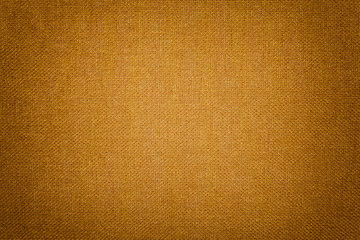 Dark orange background from a textile material. Fabric with natural texture. Backdrop.