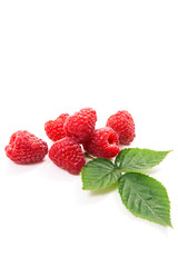 Ripe raspberries with leaf isolated on white background.