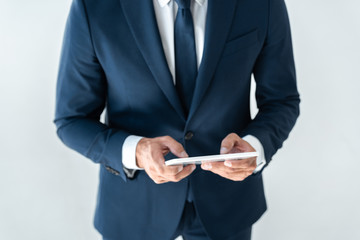 cropped image of businessman using tablet isolated on white