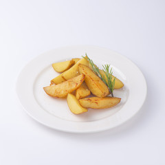 Crunchy fried potato slices with fresh rosemary isolated on white background