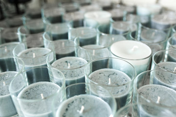 Lot of grey decorative candles in glass for event decoration