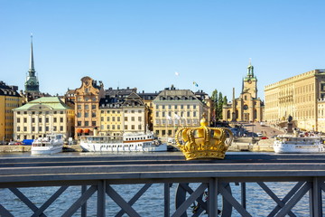Obraz premium Stockholm old town (Gamla Stan) cityscape and Royal crown, Sweden
