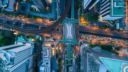 Bangkok skyline and skyscraper with bridge link between mrt and bts mass transportation on Sathorn Road center of business in Bangkok, Aerial top view, Bangkok, Thailand - obrazy, fototapety, plakaty