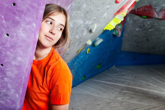 Awesome woman climbing indoor posing