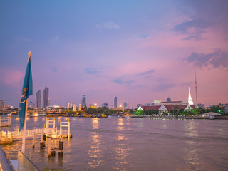 Fototapeta premium CityScape of Bangkok City and Chao Phraya River with Beautiful Sunset in Bangkok City Thailand